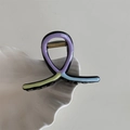 Detail view of wave-shaped hair claw clip with colorful oil-dripped finish on shell tray - Multicolor Small U-Shape Clip-Purple