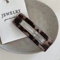 Close-up of tortoise shell pattern acetate hair clip with silver metal snap - Light Tortoise - Rectangle Clip