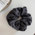 Detailed texture of dark grey polka dot bow scrunchie with woven fabric patterns - Gray with Bowknot