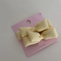 Set of two light yellow bow hair clips made of thick cotton fabric on a display card - Pair Clip / Yellow