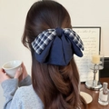 Elegant navy blue and plaid bow hair clip for women styled in a chic ponytail hairstyle - Hair Bow / Navy Blue Plaid