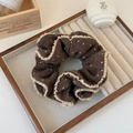 Detailed view of coffee-colored knit polka dot scrunchie with beige ruffled lace edges - Coffee Polka Dot