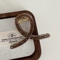 Brown marble pattern hair claw clip with golden metal spring on a wooden tray - Small Y-shape Claw / Brown