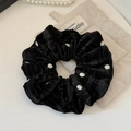 Detail of vintage black velvet polka dot scrunchie showing soft texture and pleated design - Black Polka Dot