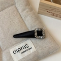 Close-up of black satin hair clip with sparkling rhinestone buckle and elegant finish - Square Diamond Style