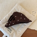 Detail view of a brown triangular pearl hair claw clip with cozy felt fabric texture - Dark Coffee