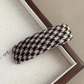 Detailed view of autumn hair clip with brown and beige houndstooth fabric texture - Fine Check
