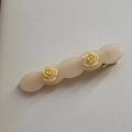 Close-up of acetic acid rose flower hair clip with elegant golden metal fastener back - Milk White