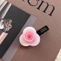 Detail of pink acetate rose hair clip with France Handmade text on the black duckbill base - Pink