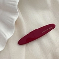 Détail de la barrette bordeaux avec lettrage doré France Handmade sur résine lisse - Rouge Nouvel An - Barrettes Ovale