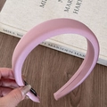 Detail showing smooth light pink satin fabric and sponge padding on the headband - Deep Pink