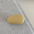 Detail view of mustard yellow teardrop hair clip with a subtle matte textured finish - Yellow