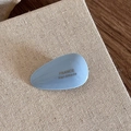 Close-up of sky blue acetate teardrop hair clip with golden France Handmade text - Light Blue