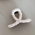 Detailed view of pink fabric wrap texture on the elegant shark hair clip accessory - Milk White Cross Shape