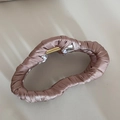Macro detail of dusky rose satin fabric wrapped large hair claw clip with golden spring - Almond Irregular