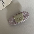 Detailed view of tweed fabric hair clip with a cute glossy resin bear embellishment - Oval / Pink