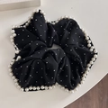 Dettaglio dell'elastico in chiffon nero con bordo di perle bianche e glitter argento - Nero