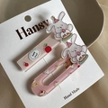 Dettaglio di due fermagli rosa con coniglio chef su cartoncino espositivo Hansy - Coppia di Conigli Rosa