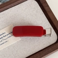 Detailed close-up of a vibrant red rectangular hair clip on a premium jewelry tray - Rectangle Candy Clip / Red