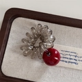 Detail of grey spiral hair tie with a red cherry bead accent on a rustic wooden tray - Telephone Line - Red Ball / Red