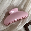 Detailed macro view of the glossy pink fan-shaped hair claw clip on soft fabric - Simple Fan-Shaped / Light Pink