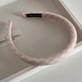 Close-up of pink and white checkered headband with soft sponge padding and handmade label - Orange Plaid