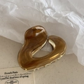Dettaglio molletta per capelli in resina tartarugata con base in metallo dorato retrò - Marrone