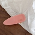 Macro detail of a pink acetate hair clip showing the golden France Handmade logo lettering - Pink