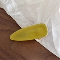 Detail of French vintage acetate hair clip with mustard yellow color and gold engraving - Green