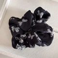 Detail of vintage black satin hair scrunchie with elegant white butterfly pattern - Hair Tie / Print Butterfly Black