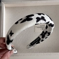 Close-up of handmade white fabric headband with black butterfly jacquard and inner label - Headband / Print Butterfly White