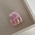 Close-up of pink marble pattern acetate hair claw clip with Barrette La France text - Sakura Pink