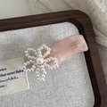 Close-up of pink acetate hair clip with white pearl flower and France Handmade detail - Pearl Flower Wave Shape - Pink