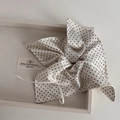 Detailed close-up of cream polka dot lace scrunchie with silky texture and ribbon - Square Scarf Style / Cream Polka Dot