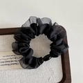 Detailed view of black organza scrunchie with pleated mesh edges and decorative pearl bead - Mesh Edge Basic Loop - Black