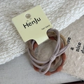 Elastic hair band set in brown and grey tones on minimalist white knitted background - Yellow