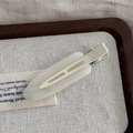 Elegant cream translucent resin duckbill hair clip with matte finish on wooden tray - Jelly Color Large No-Trace - Milk White