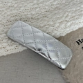 Detail view of y2k silver quilted leather hair clip on soft fabric background - Silver Lattice Rectangular