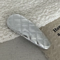 Detail of silver quilted faux leather Y2K hair clip with metallic finish on knit fabric - Silver Lattice Water Drop