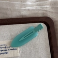 Matte mint green resin hair clip with classic metal duckbill clasp on a wooden tray - Jelly Color Small No-Trace - Blue Green