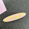 Pink oval hair clip with yellow bow patterns and a glossy resin finish for hair styling - Oval / Milky Apricot