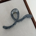 Translucent smoky gray wavy hair claw clip with gold spring on a neutral tray - Jelly Cross Wave-Fog Blue