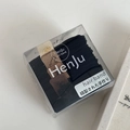 Detail of high-elasticity hair bands in a transparent box with minimalist design - Box Packaging / Black