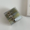Close-up of Morandi green high-elastic hair bands with textured ribbing in a transparent gift box - Box Packaging / Green