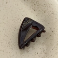 Detailed close-up of dark brown tortoiseshell acetate hair clip with gold text - Dark Coffee