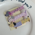 Detailed close-up of cute cartoon dachshund puppy hair clips set on paper card - Dachshund Set / Pink Pink Yellow