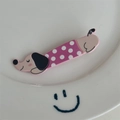 Close-up of cute pink dachshund hair clip with purple polka dot coat on a white plate - Single Piece / Rose Red