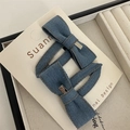 Detail of blue denim bow hair clips with silver engraved metal charms on card - Denim Metal Heart Bow BB Clip
