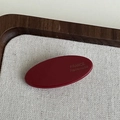 Handmade wine red oval acetate hair clip with France engraving on a rustic wooden tray - Red