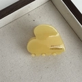 Detail of light yellow acetate heart hair claw with France Handmade gold lettering - Heart Acetate Gold Label - Yellow